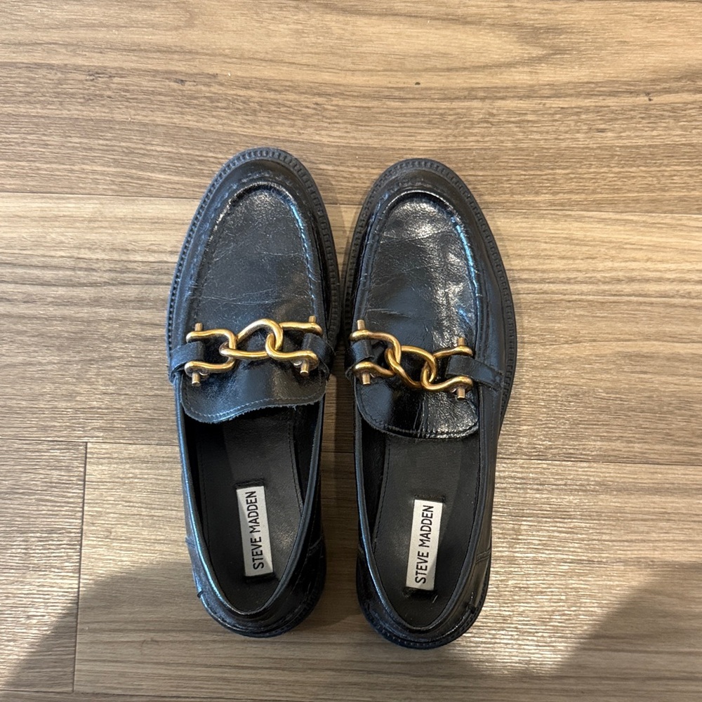 Steve Madden Glossy Black Loafers with Gold Accent